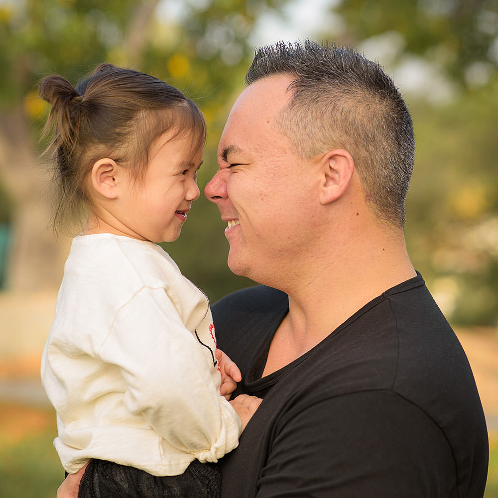 Love-Story-Photography-smiling-fun-dad-daughter-park-portrait